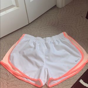 White and pink/peach Nike shorts